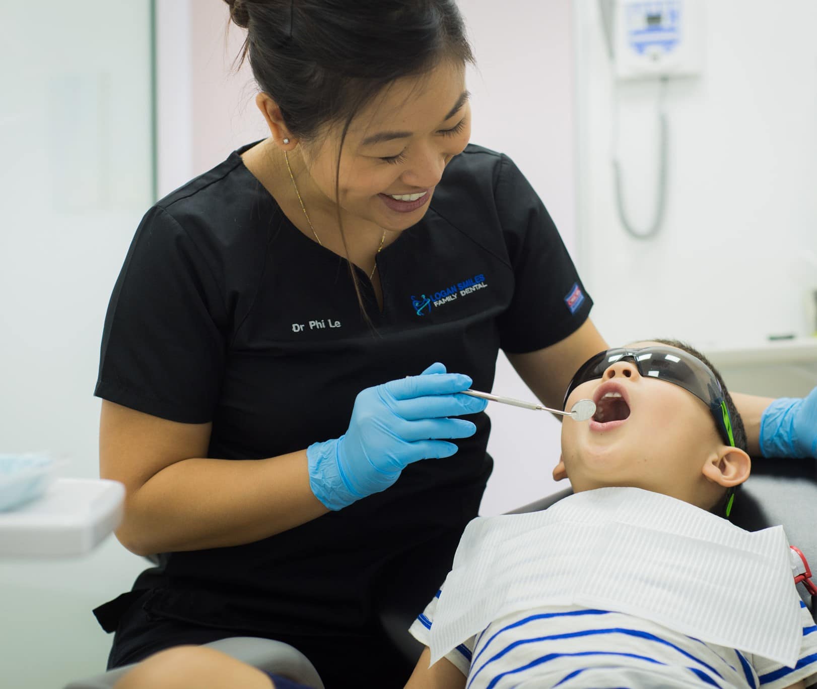 Dr Phi childrens dentistry checking child's teeth